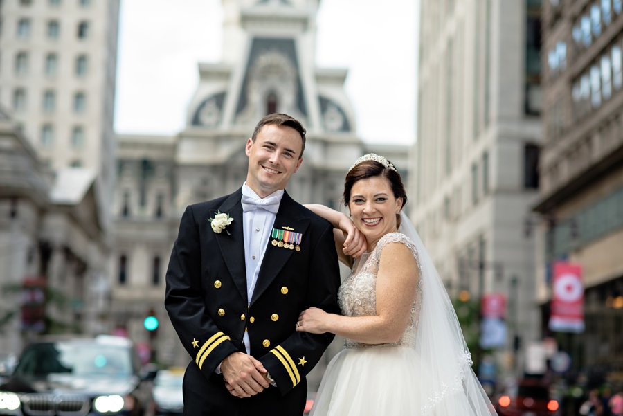 A newly married couple in the middle of broad street.
